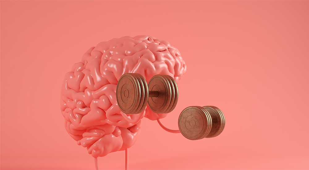 Ein Gehirn mit Hanteln auf rosa Hintergrund