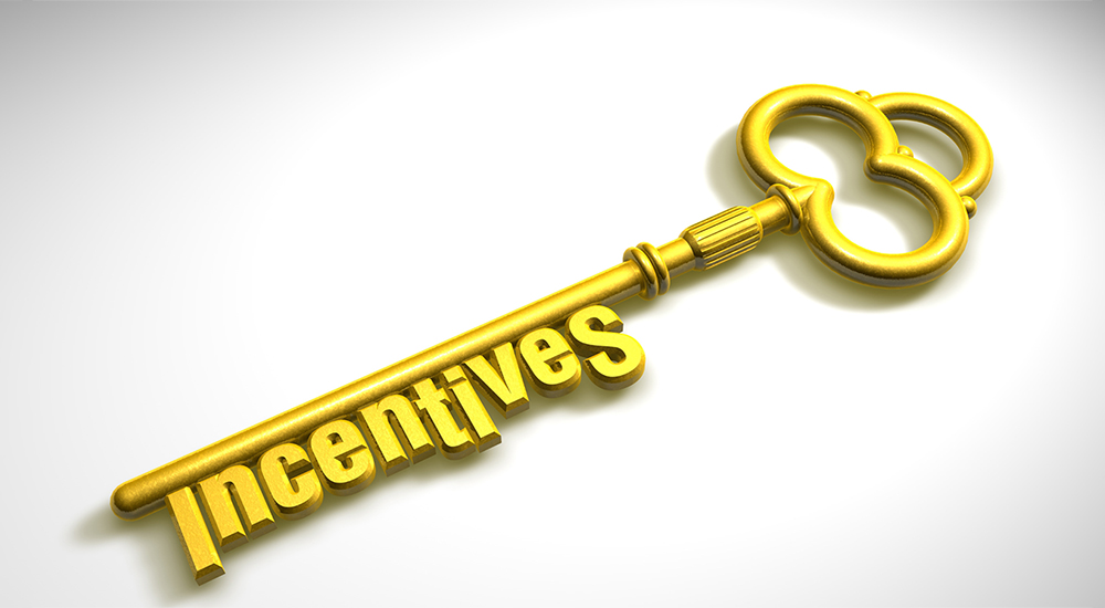 a golden key on a white background with the word incentives written on it