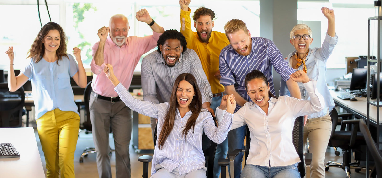 cheering people in an office environment